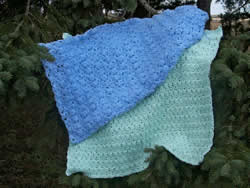 Handmade crocheted sewn by hand baby and adult afghans are a special luxury from Windy Ridge Handcrafted, a natural bath and body product line from aplington parkersburg, Iowa, local area business.
