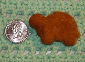Homemade Dog Biscuits and healty puppy Treats shown on this crocheted and knitted blanket