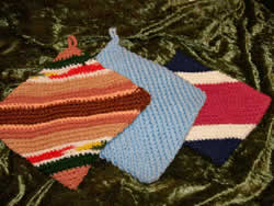 Custom made crocheted and sewn oven mitts from home, these hot pads will help in the kitchen plus they can be customized upon ordering. 